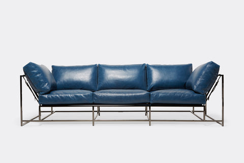 Front of Sofa with blue leather upholstery and polished black nickel metal frame