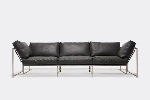 front of Sofa with black leather upholstery and antique nickel metal frame