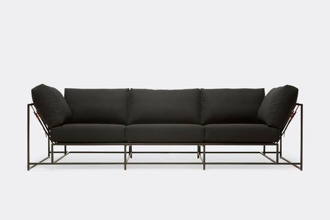 front of sofa with black canvas upholstery on black metal frame