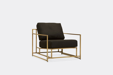 side of armchair with black wool upholstery on antique brass metal frame