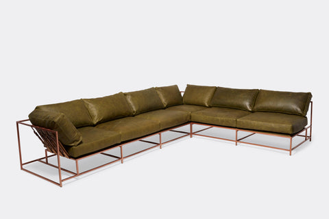 front of sectional with green leather upholstery on antique copper metal frame