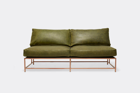 front of loveseat with green leather upholstery on antique copper metal frame