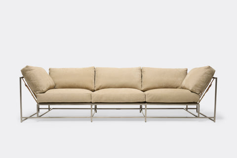 Front of Sofa with tan leather upholstery and antique nickel metal frame