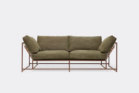 front of two seat sofa with olive canvas upholstery and marbled rust metal frame