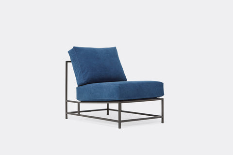 front of chair with blue canvas upholstery on black metal frame