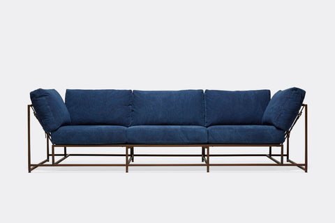 front of three piece sofa with blue canvas upholstery on marble rust metal frame