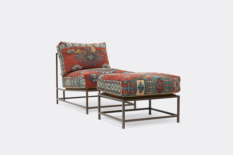 side of chair and ottoman with vintage rug upholstery on marble rust frame