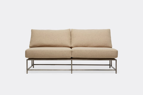 front of loveseat with tan wool upholstery on antique nickel metal frame