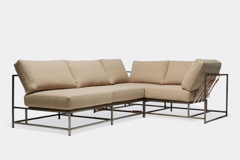 front of sectional with tan wool upholstery on antique nickel metal frame
