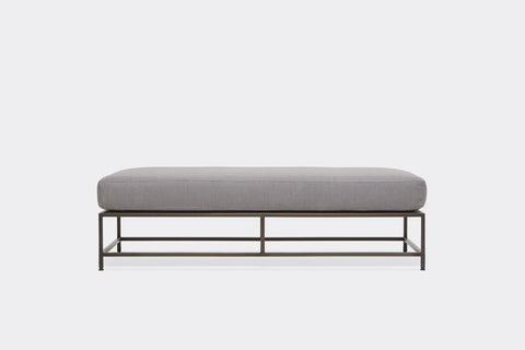 front of bench with grey wool upholstery on black metal frame