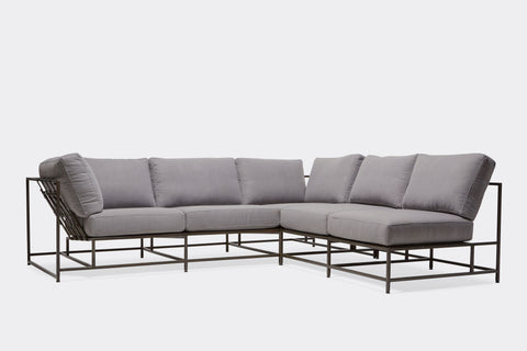 front of sectional with grey wool upholstery on blackened steel metal frame