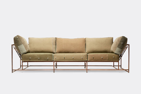 front of three piece sofa with green canvas upholstery on antique copper metal frame
