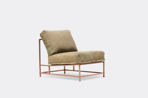 front of chair with olive green canvas upholstery and antique copper metal frame