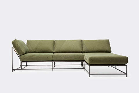 back of sectional with green canvas upholstery on black metal frame