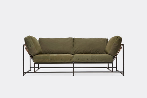 front of two seat sofa olive canvas upholstery and black metal frame