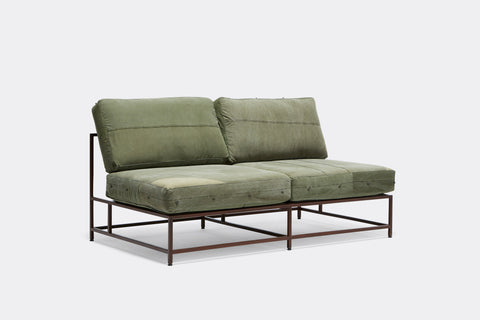 front of loveseat with green canvas upholstery on marble rust metal frame