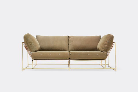 Back of two seat sofa with tan canvas upholstery and polished brass metal frame