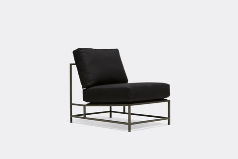 front of lounge chair with black canvas upholstery and black metal frame