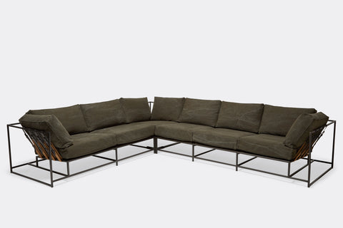 front of sectional with olive canvas upholstery on blackened steel metal frame