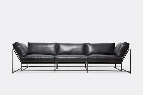 front of three piece sofa with blue leather upholstery on black metal frame