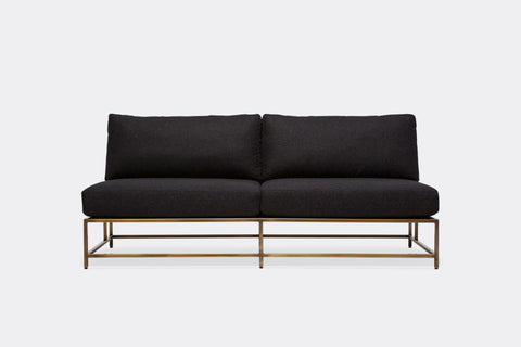 front of loveseat with black wool upholstery on antique brass metal frame