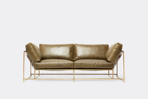 front of two piece sofa with green leather upholstery on antique brass metal frame