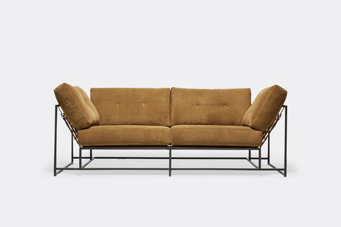 front of two seat sofa with tan fabric upholstery on blackened steel metal frame