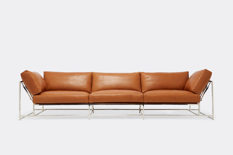 front of Sofa with brown leather upholstery and polished nickel metal frame